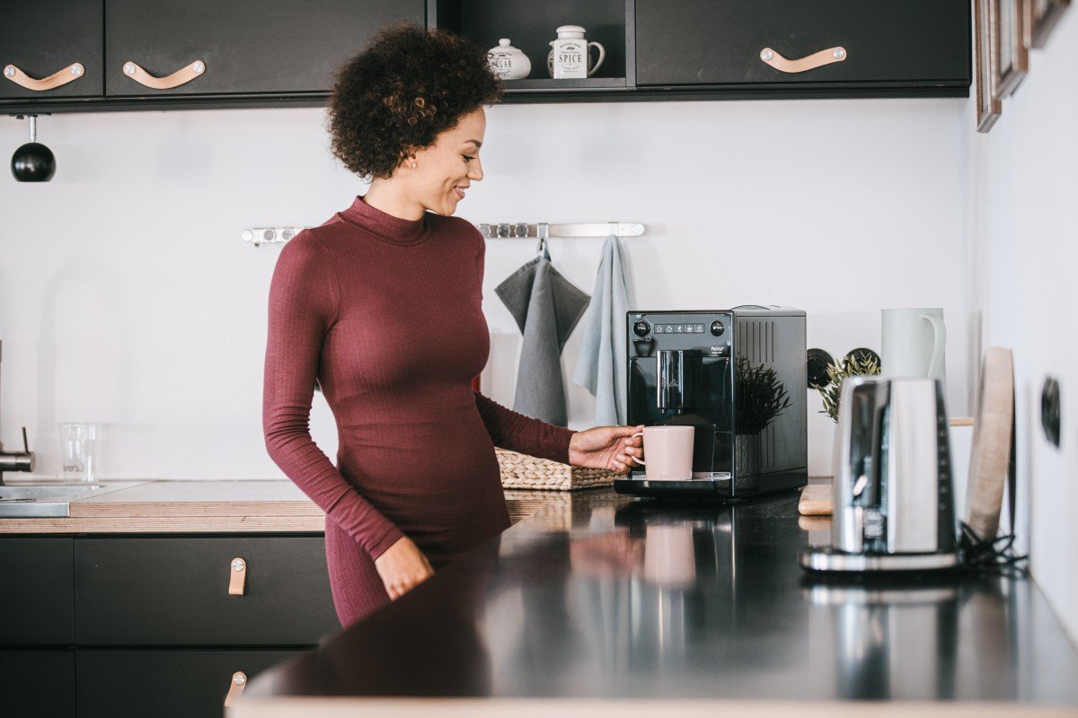 Woman making coffee with a Melitta Solo black