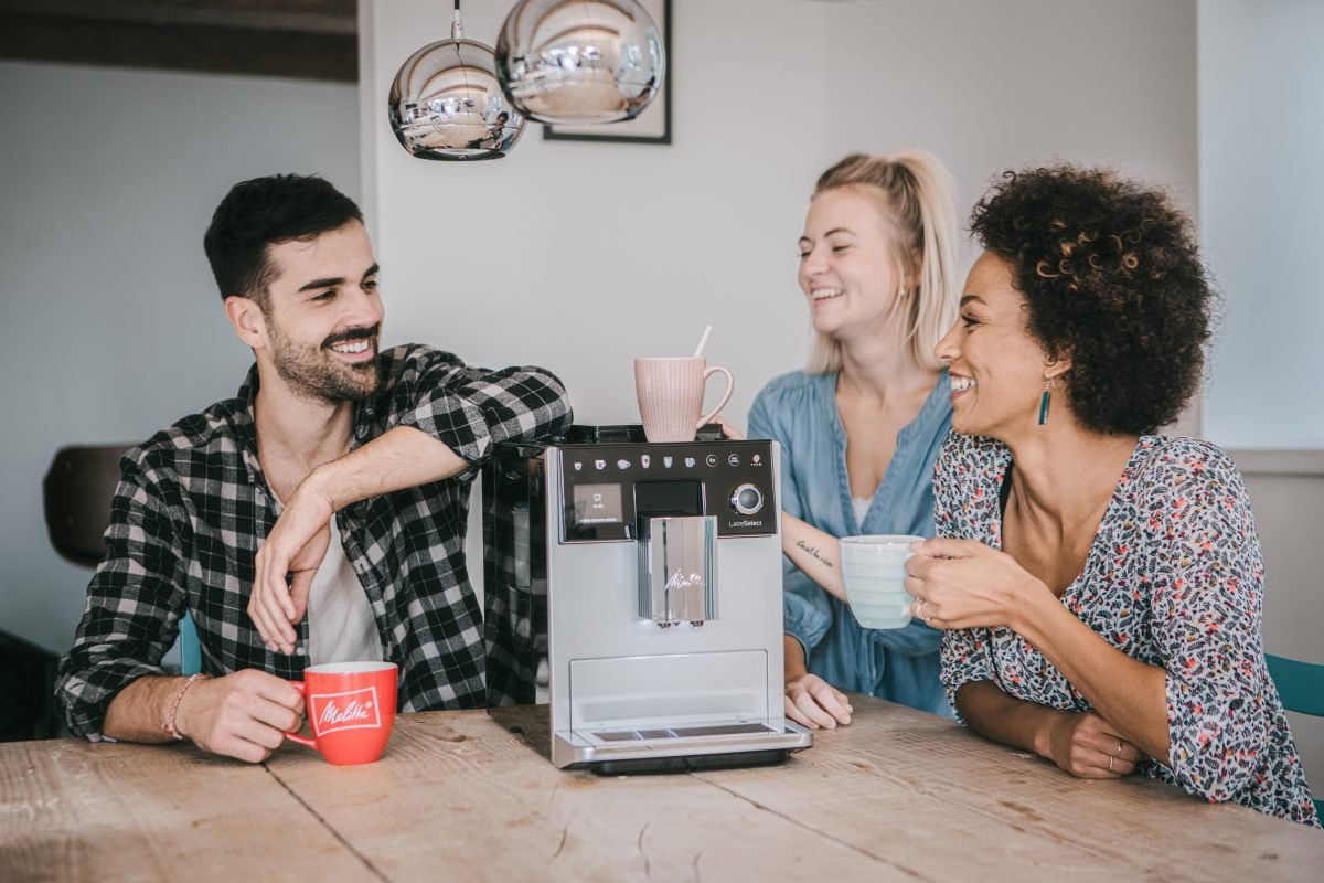 Group of friends enjoying Melitta coffee with the Melitta LatteSelect