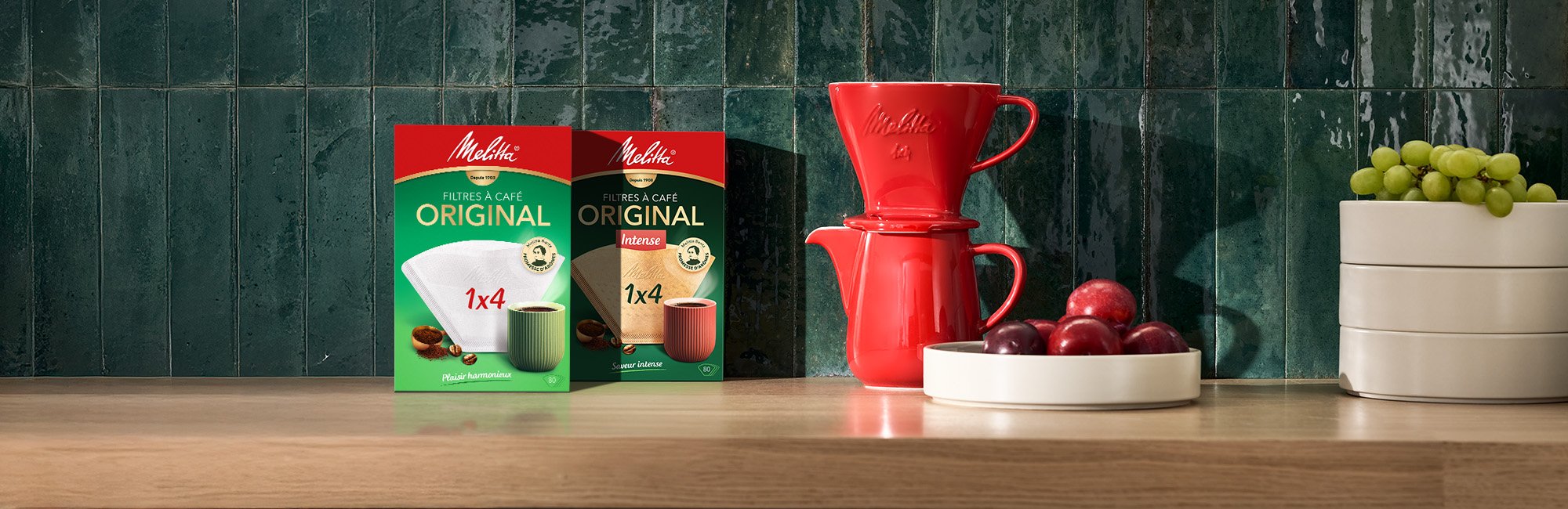 Image of a nice countertop where our coffee filters are placed in their beautiful red and green case.