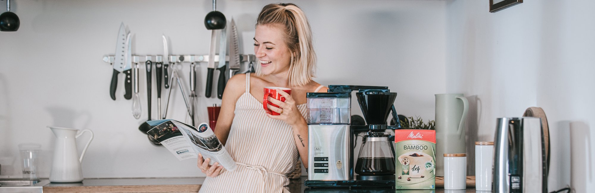 Woman drinking Melitta Coffee with Melitta AromaSignature Deluxe