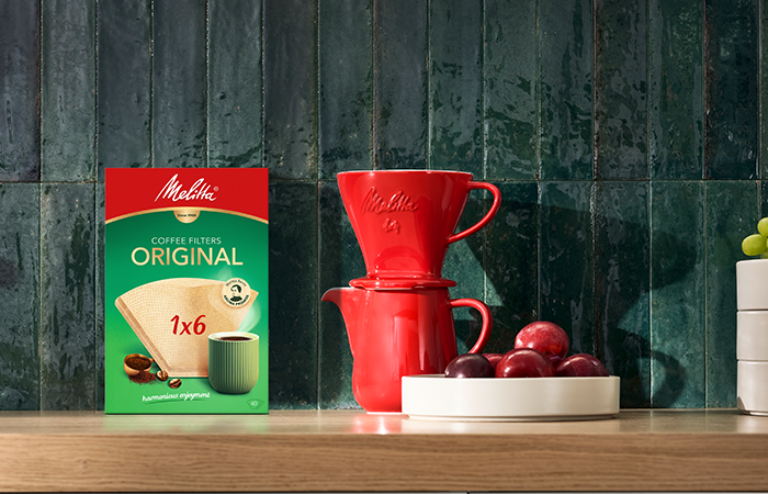 Image of a red porcelain coffee pot and filter holder accompanied by one of our coffee filter boxes in size 1 X 6.